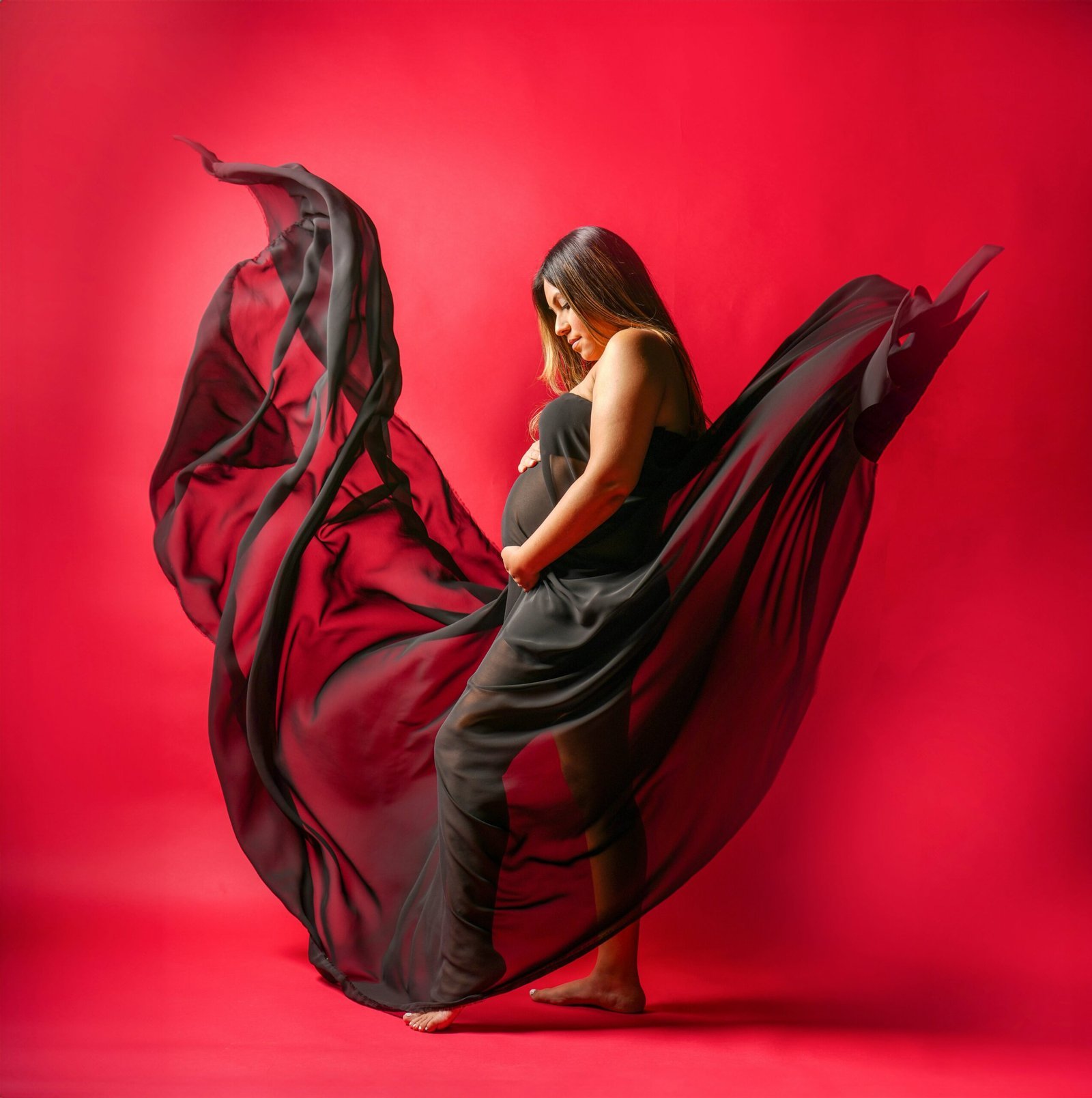 a woman in a black and red dress